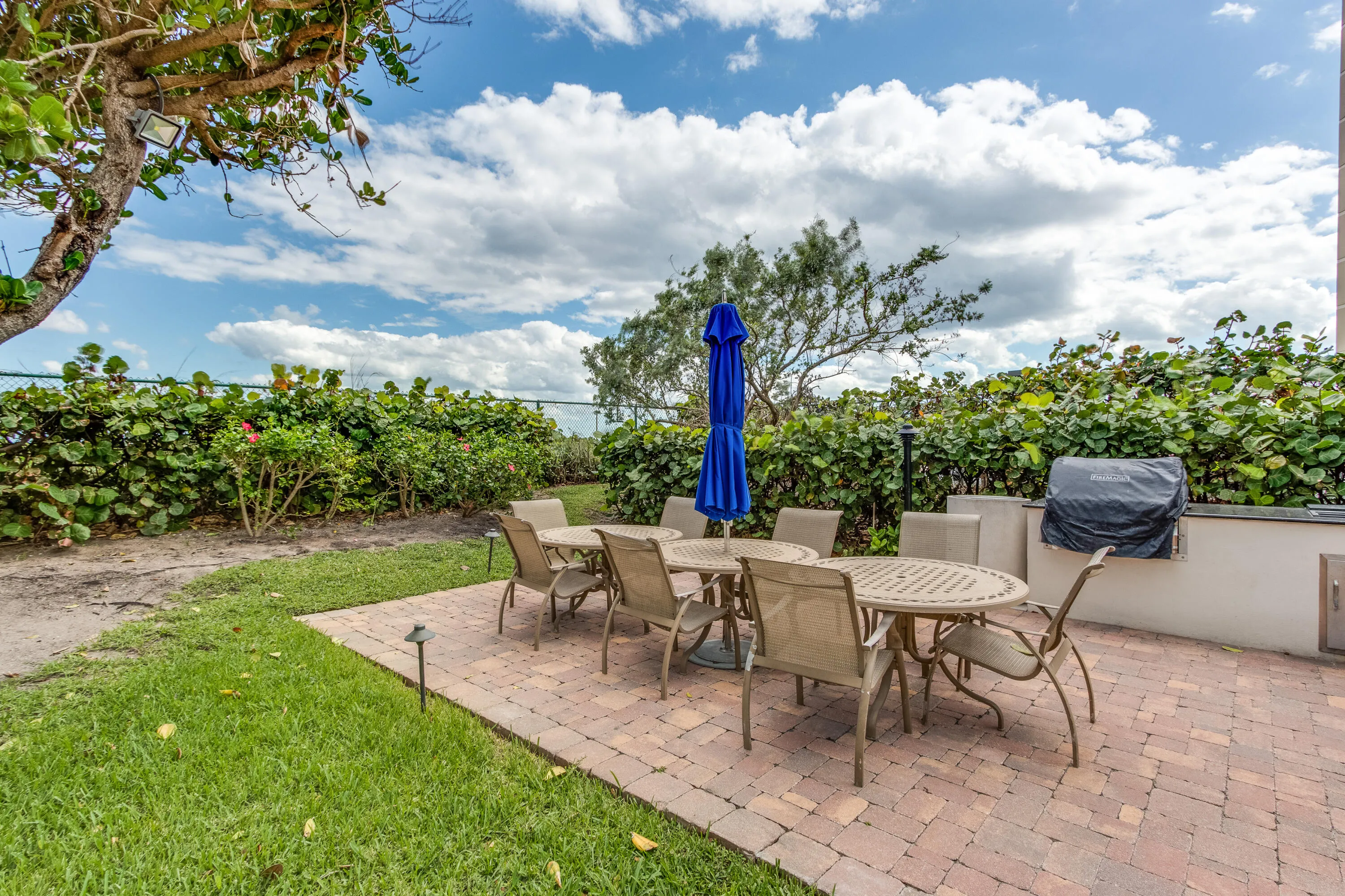 Aerial view highlights Tiara within Singer Island's beachfront skyline and surrounding waterfront community.