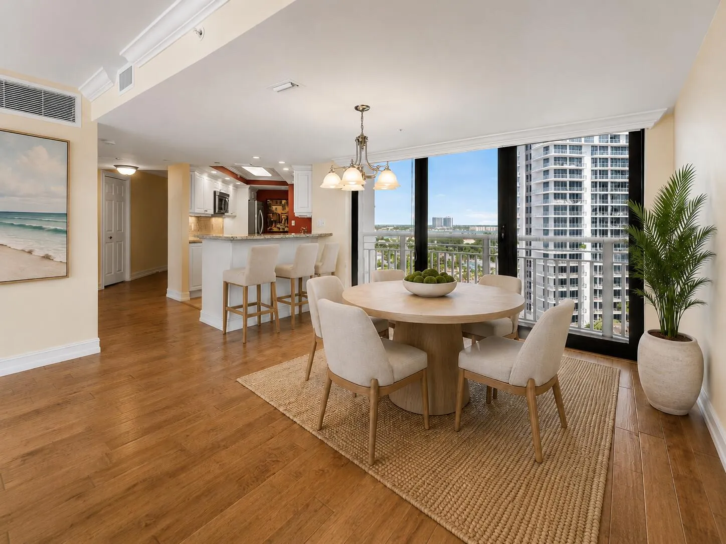 Virtually staged; residence is offered unfurnished. The dining area connects naturally with the kitchen and surrounding living space for an open, flexible layout.