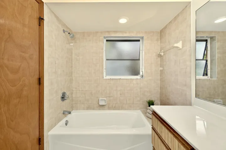 Ensuite bathroom with tub/shower.