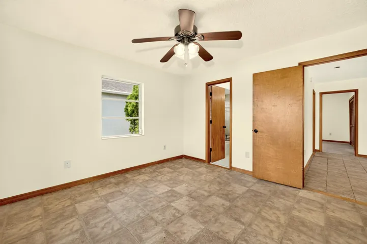 BEDROOM 1 with ensuite bathroom, faces front yard.