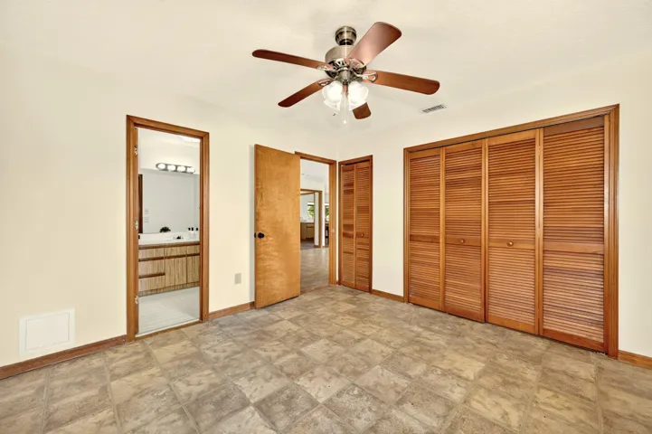 BEDROOM 1 with ensuite bathroom, faces front yard.