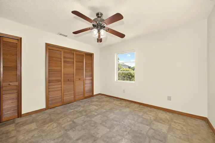 BEDROOM 1 with ensuite bathroom, faces front yard.