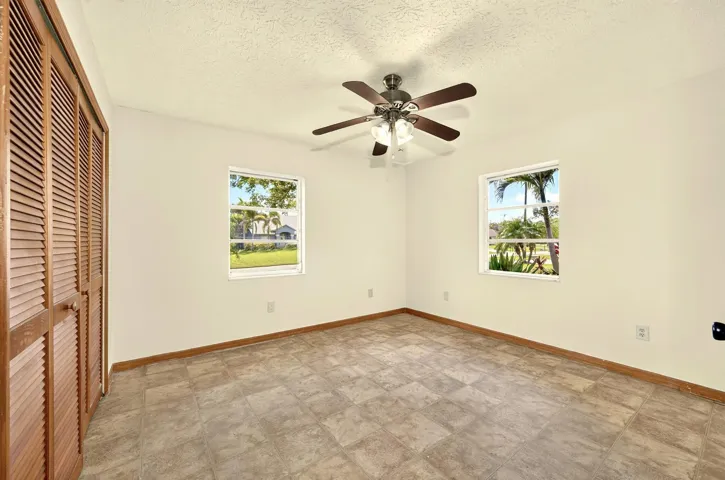 BEDROOM 1 with ensuite bathroom, faces front yard.