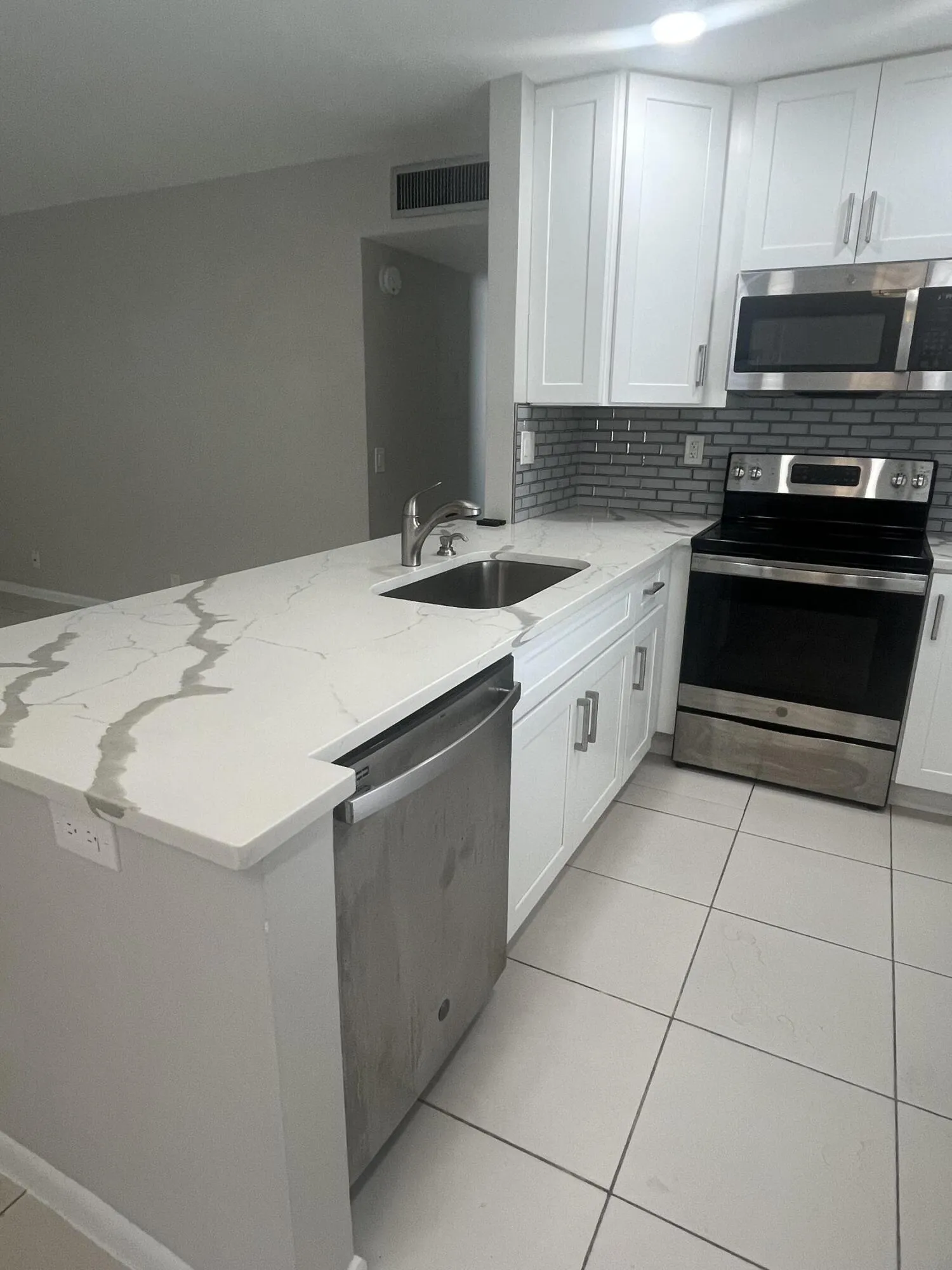 Open concept kitchen with the wall having been taken out