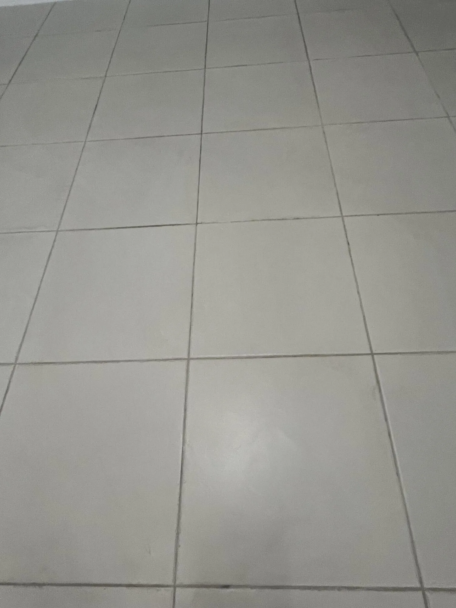 beautiful white neutral colored tiling throughout the condo