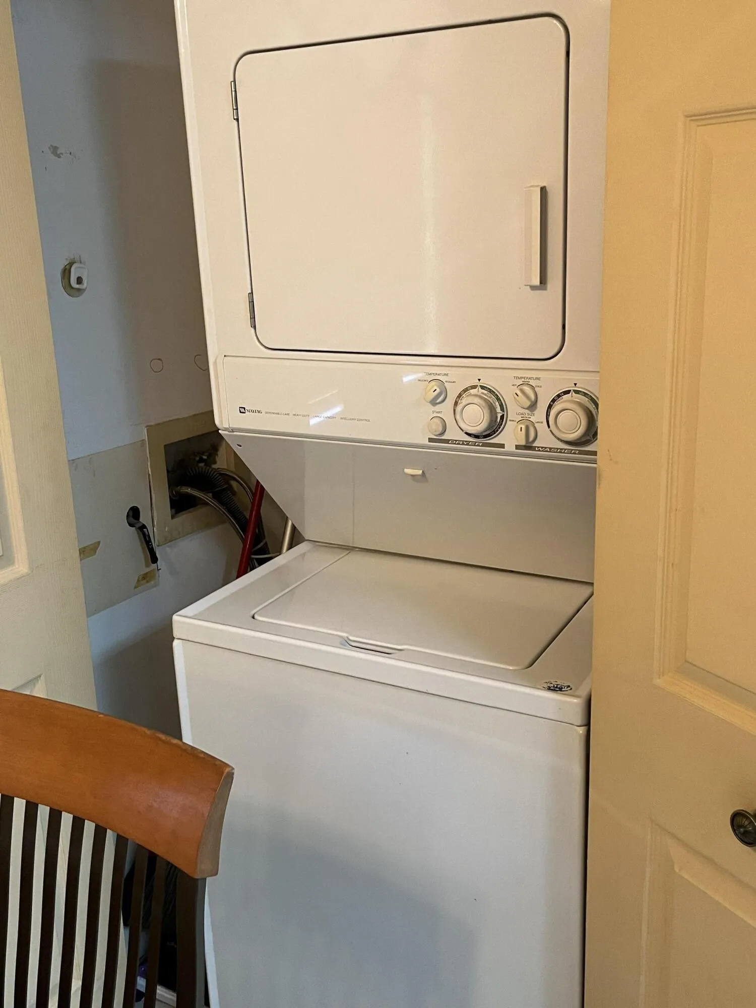 oversized stackable washer/dryer in the kitchen pantry closet