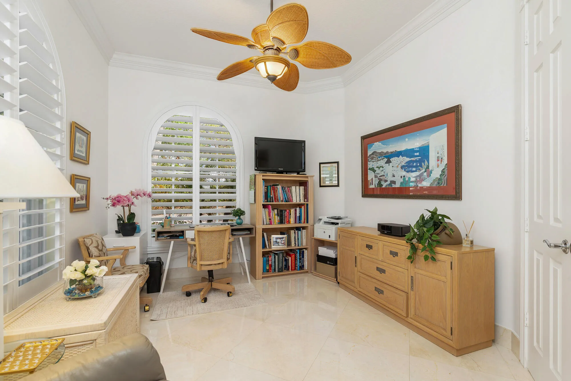 Den and/or office with plantation shutters, crown molding