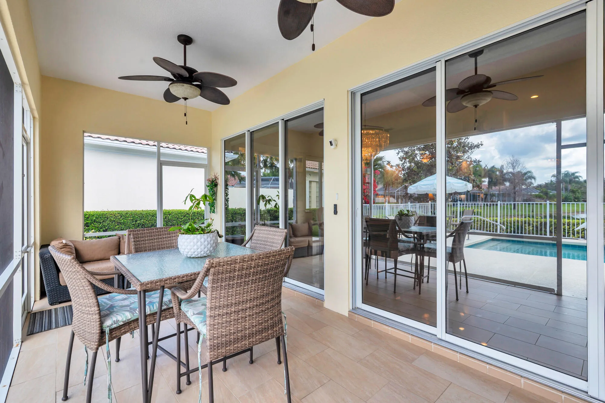 outside patio with porcelain tile flooring & fans