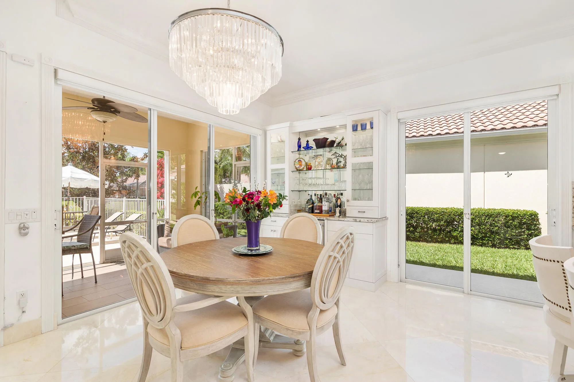 Lots of sliding glass doors w/ custom window treatments