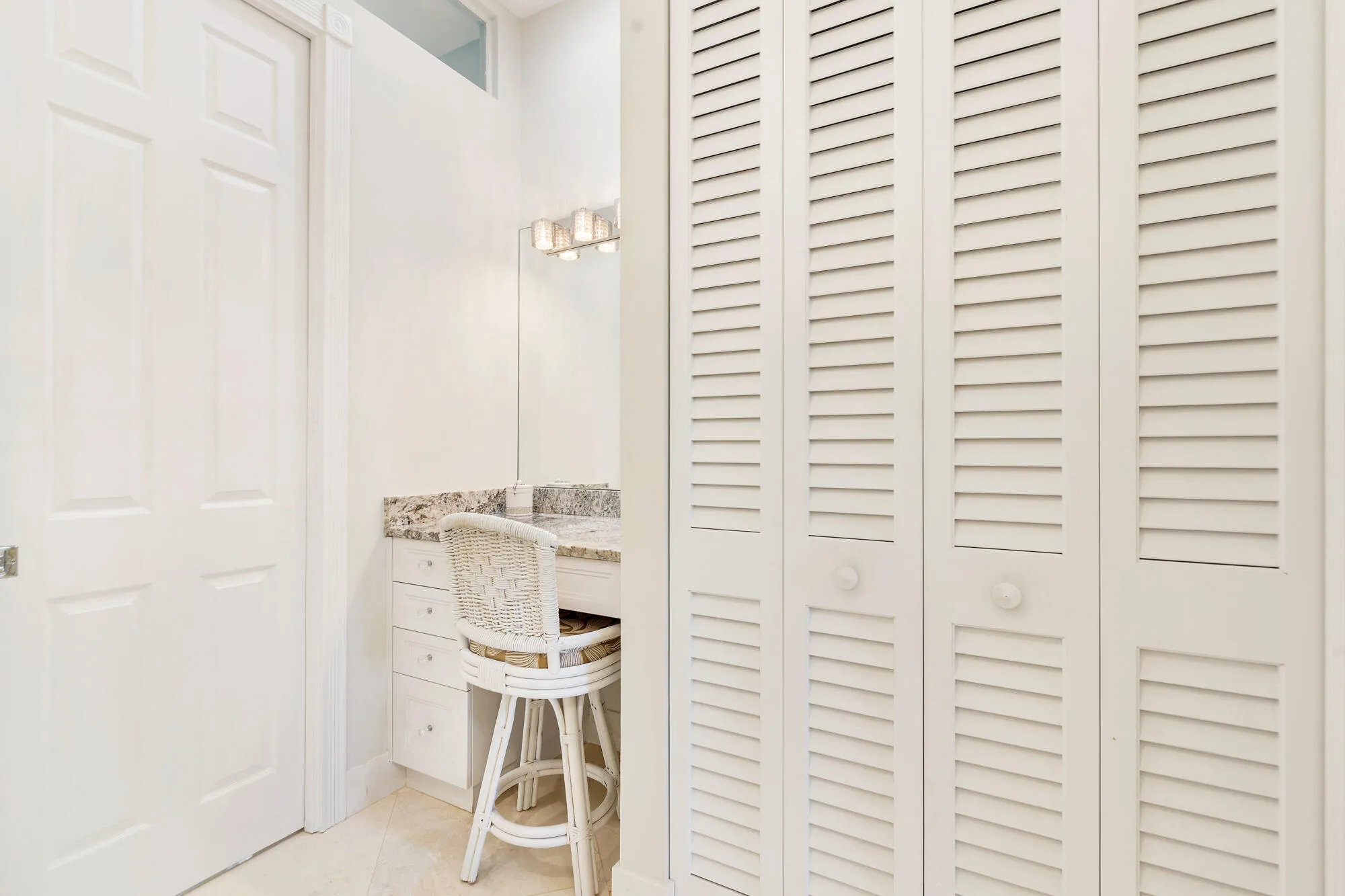 Primary bedroom with vanity & custom double linen closet