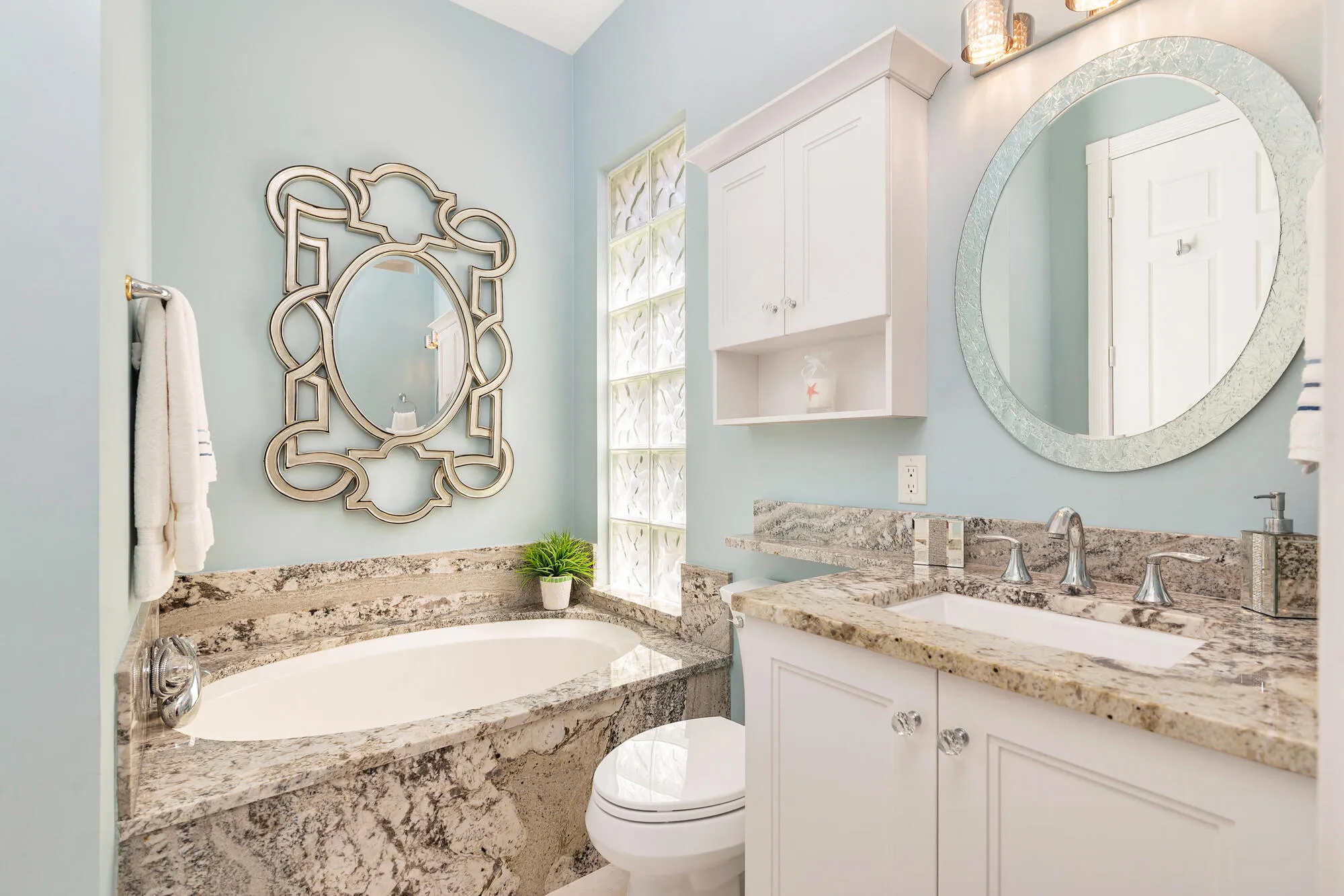 Custom 3rd bathroom with hallway door. Kohler toilets