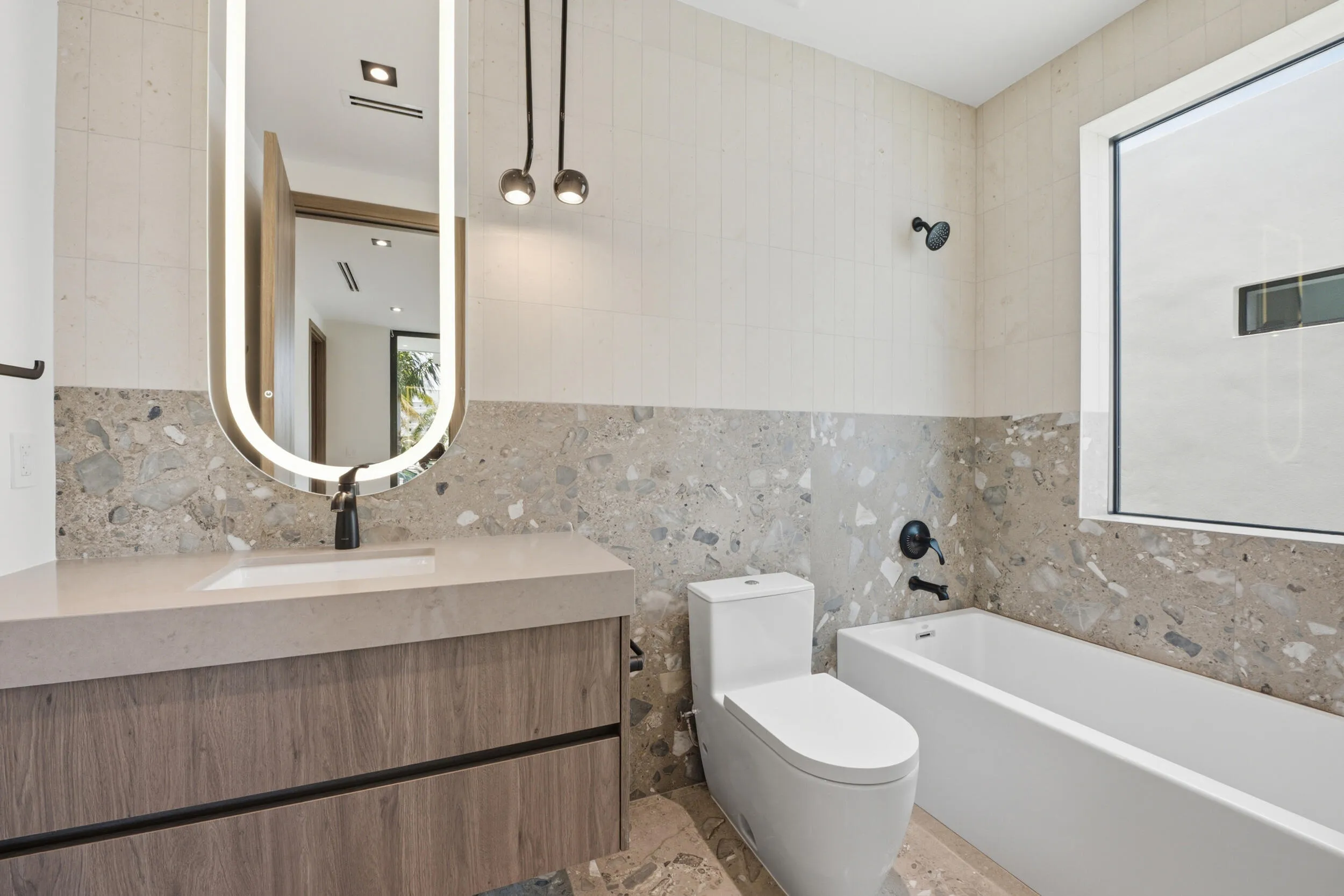 Floating vanity with wood-finish cabinetry and integrated sink
