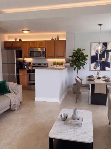 Virtually Staged - Living room looking towards kitchen and dining area.