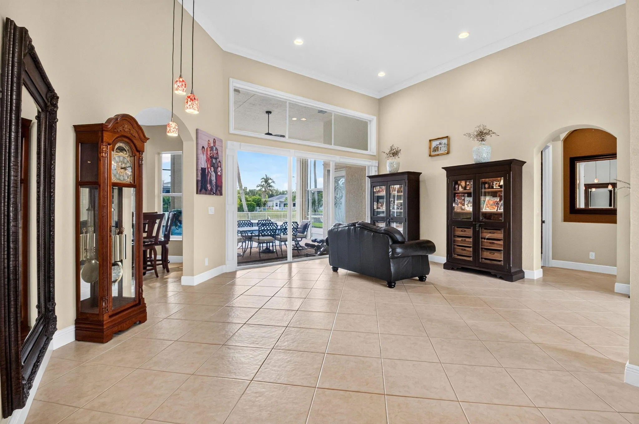 Vaulted ceilings, recessed lighting, and large format tile flooring