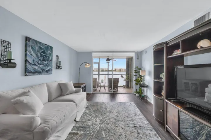 View through living room &patio to lake
