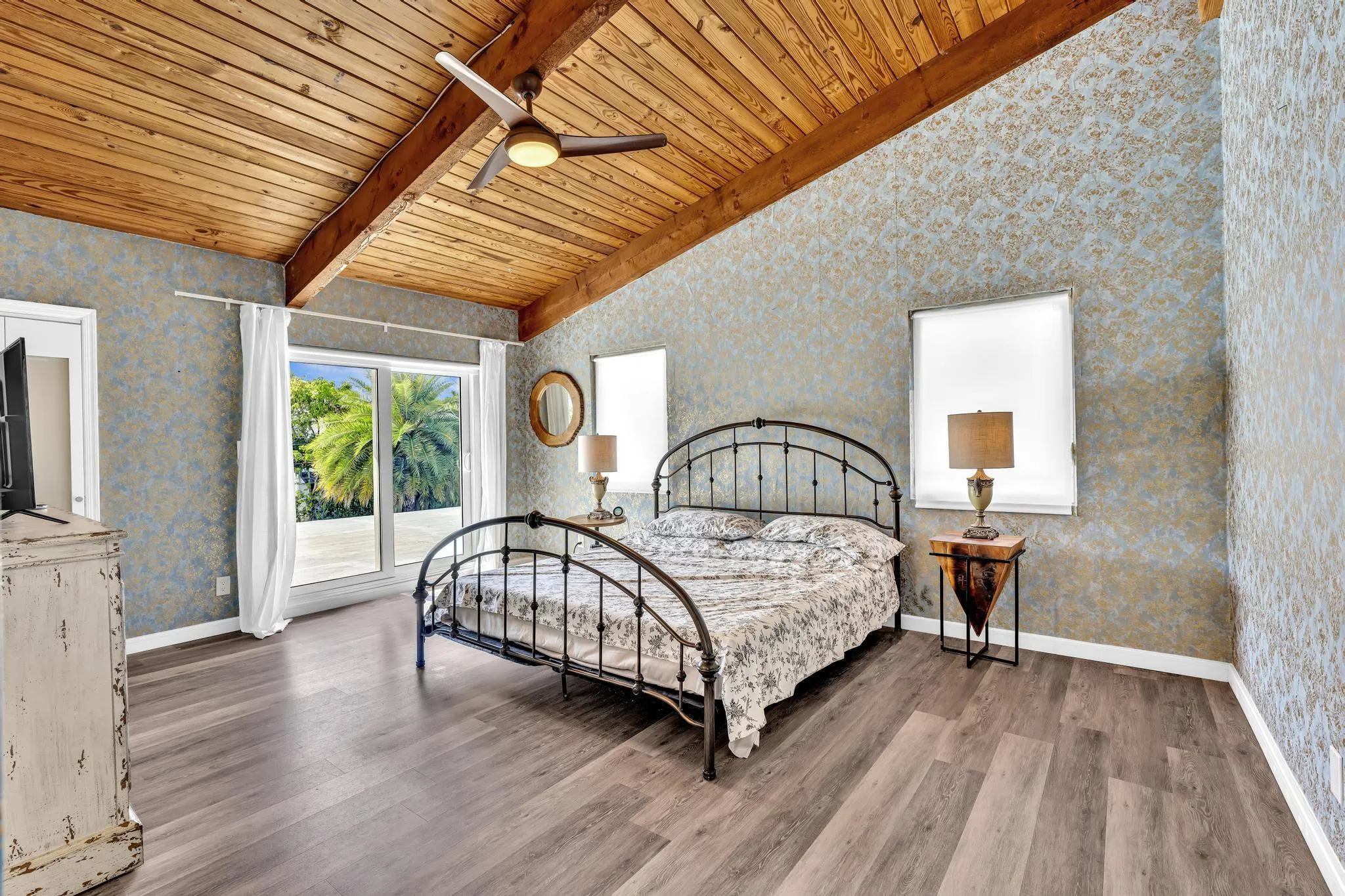 Master Bedroom with vaulted ceilings and roof access.