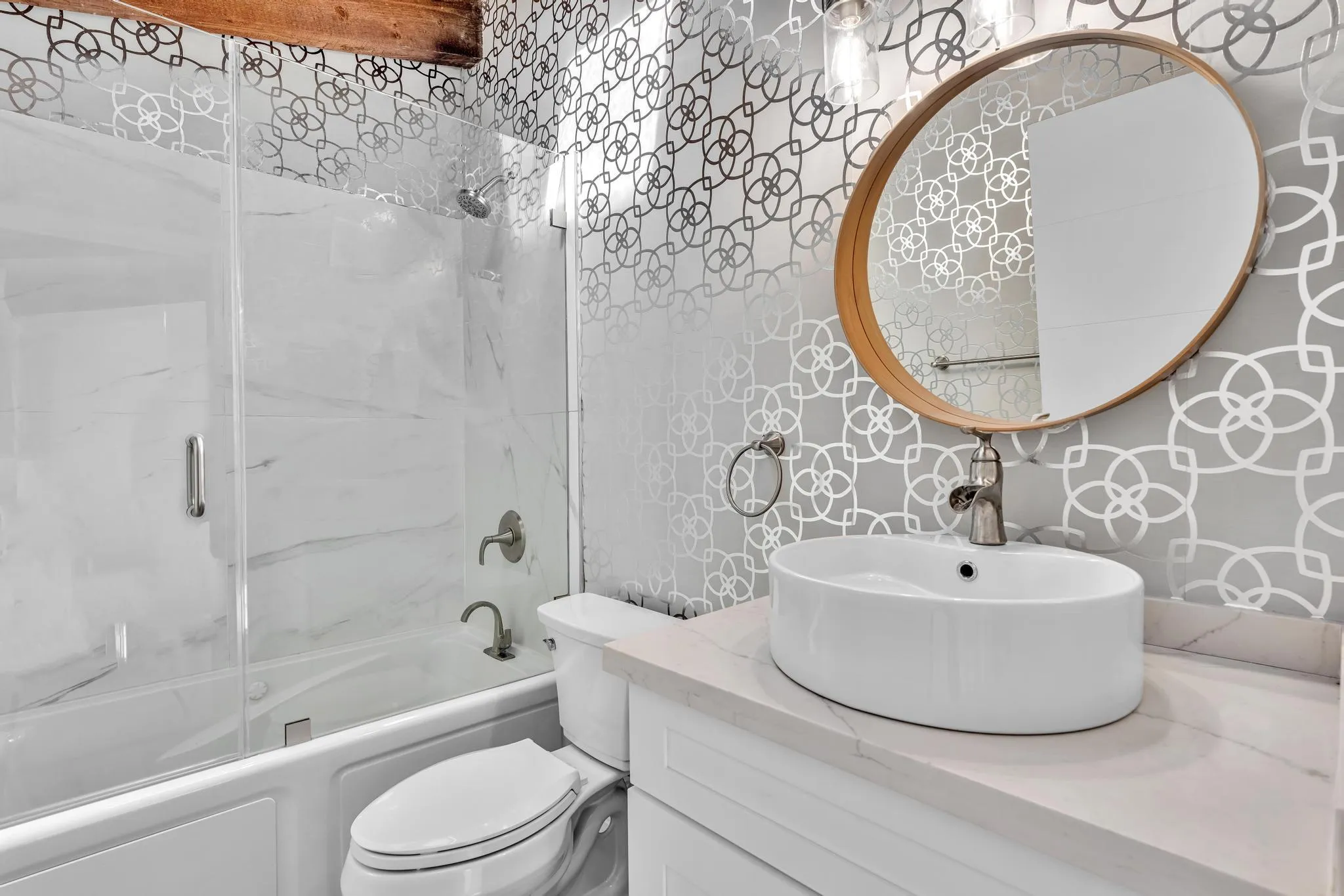 Second Bathroom with glass door shower.