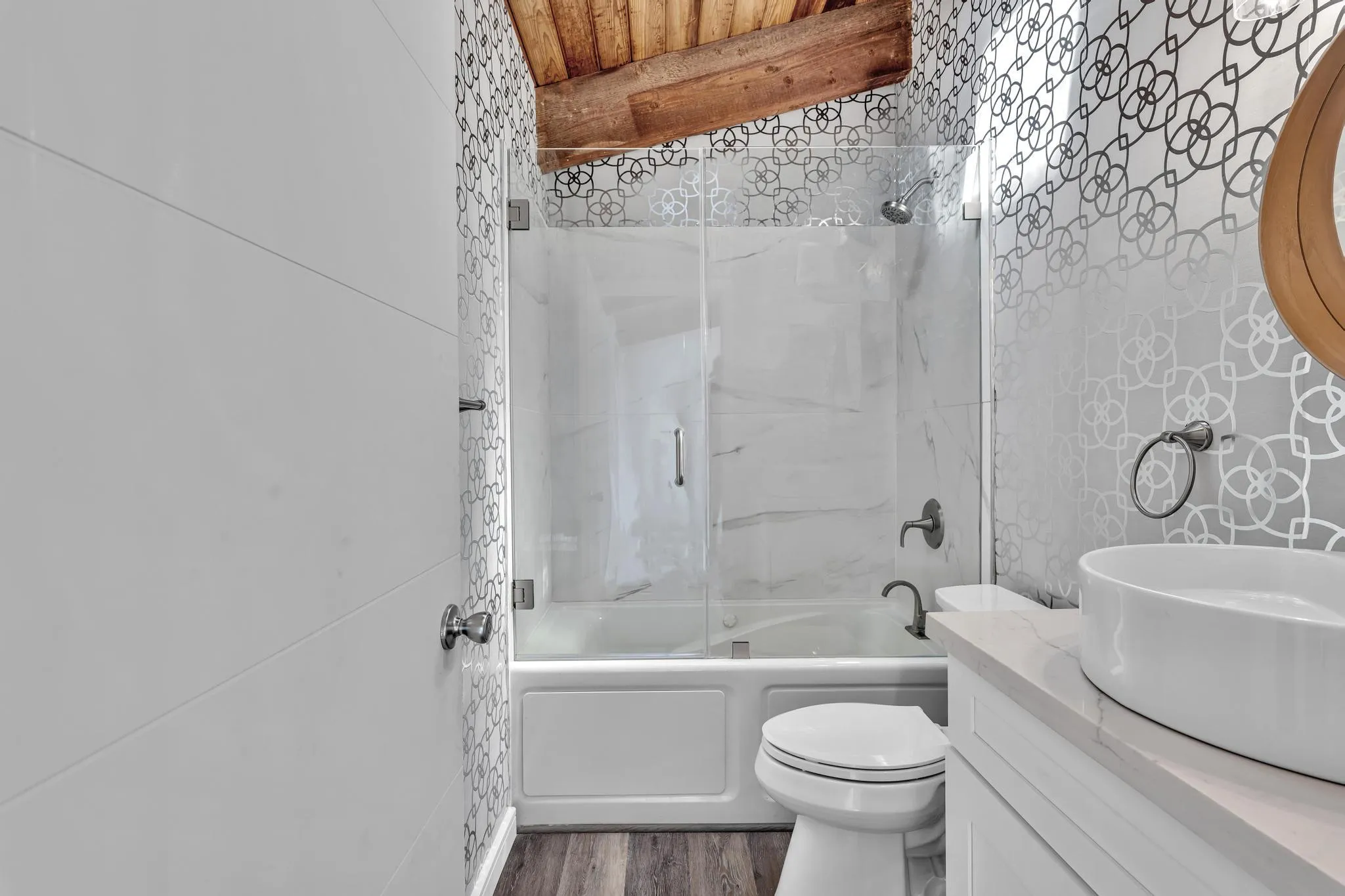 Second Bathroom with glass door shower.