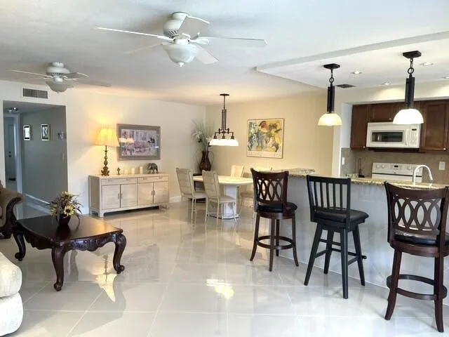 Open concept kitchen and dining area vie