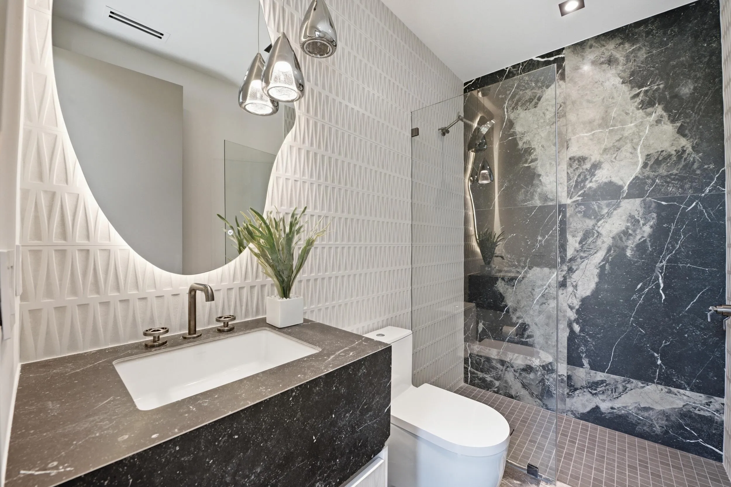 Vanity with integrated rectangular sink and dark countertop