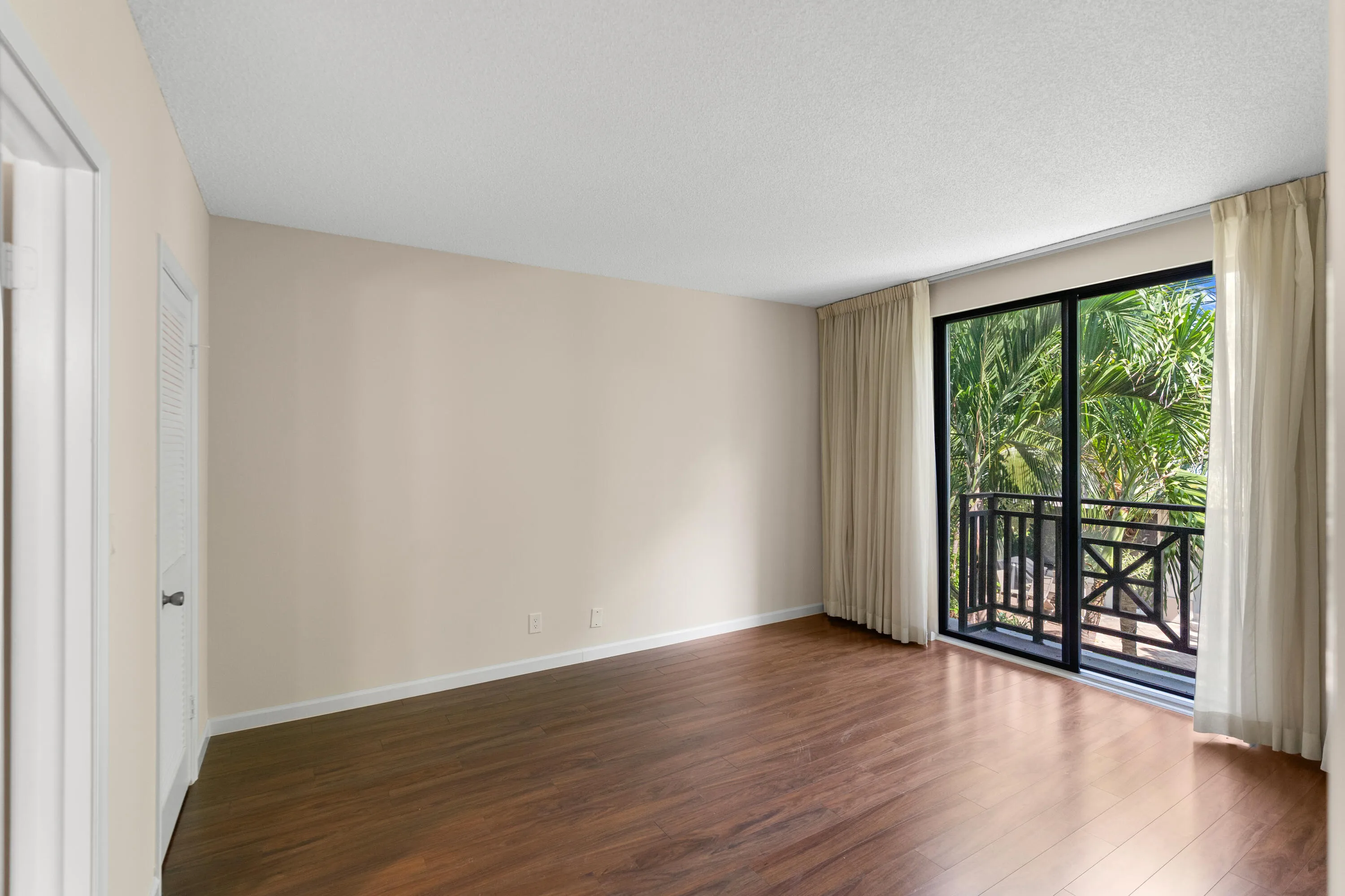 Primary bedroom with sliders