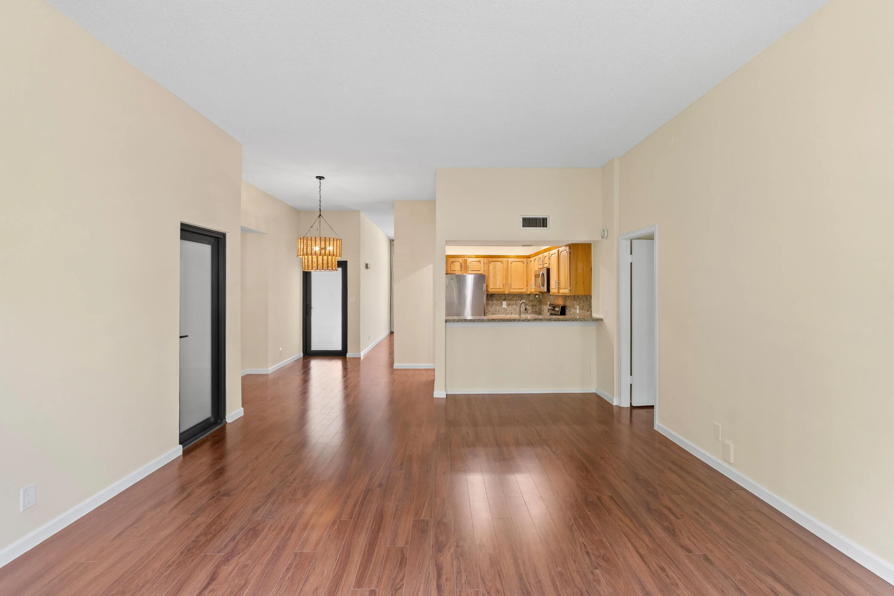 Family room with exterior door that leads to stairs down to the garden patio
