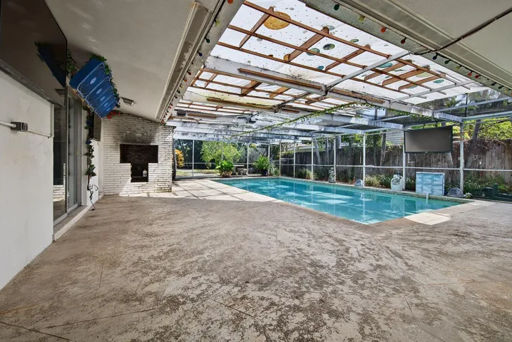 Expansive screened patio and pool area offers abundant room for lounging, dining and entertaining.