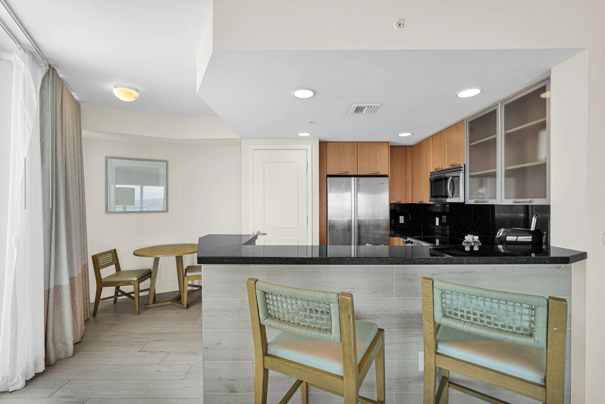Kitchen with a snack bar and dining area