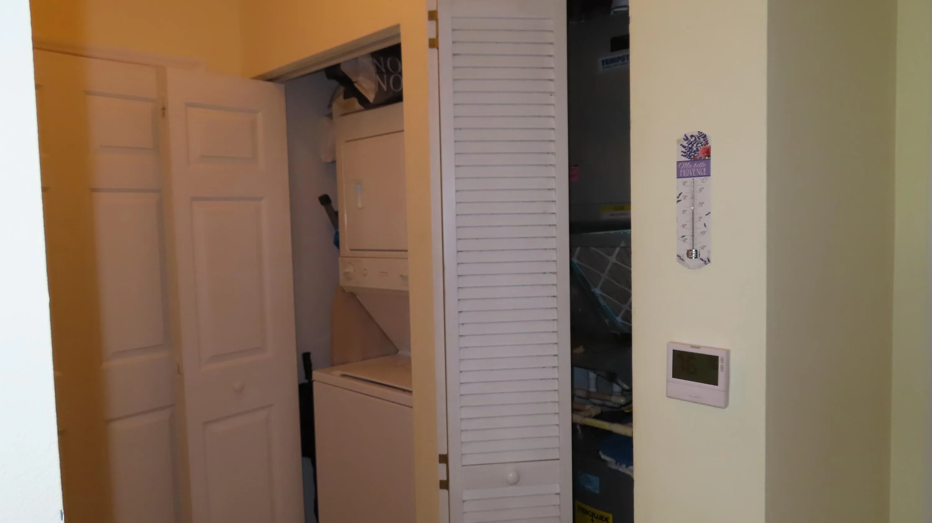 Washer, Dryer, Closet with Air Conditioner and new water heater.