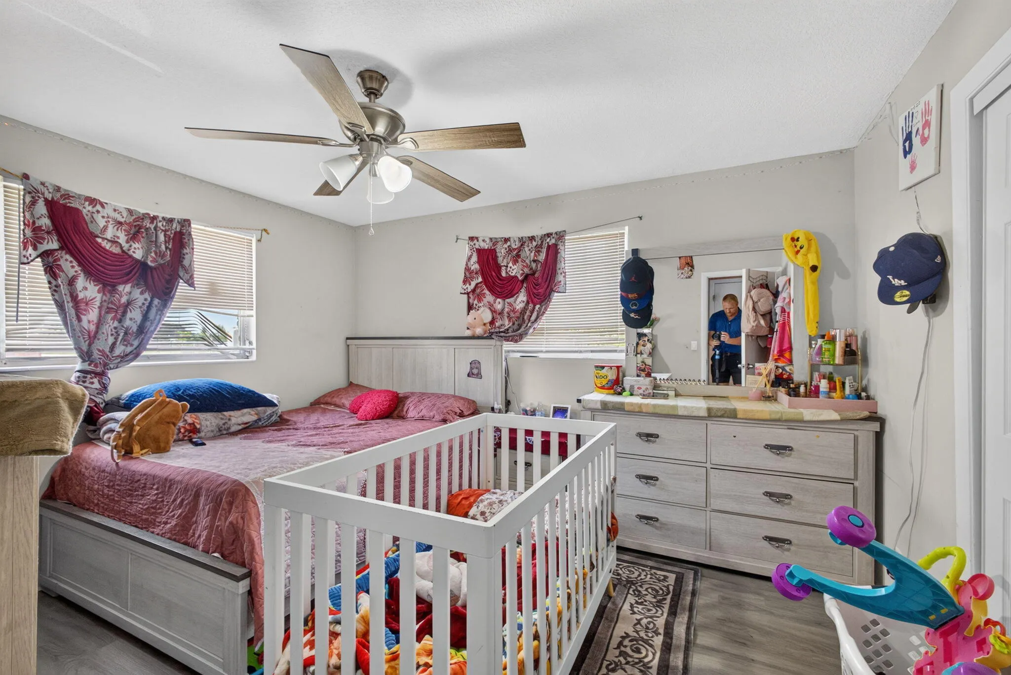 Wood-finish flooring with a ceiling fan and light kit