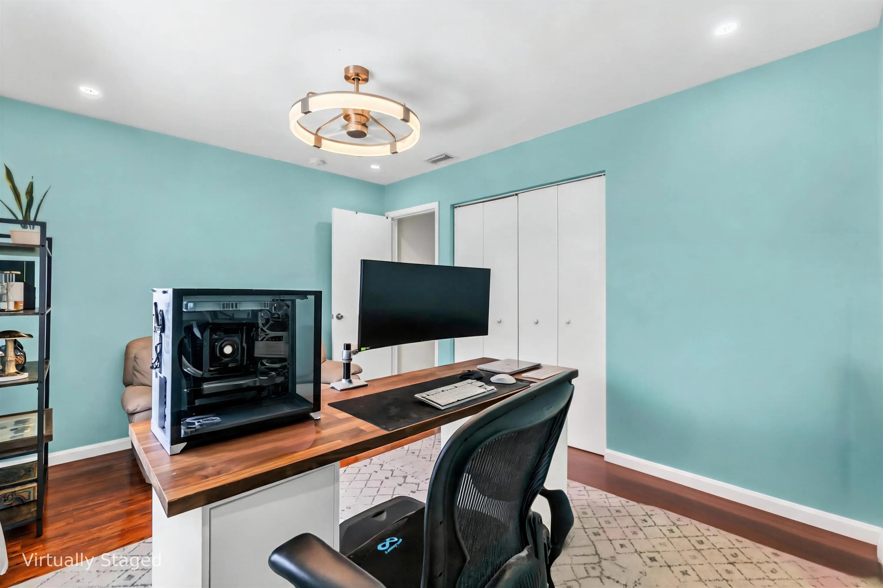 Recessed lighting, wood-finish flooring, and a modern semi-flush mount light fixture