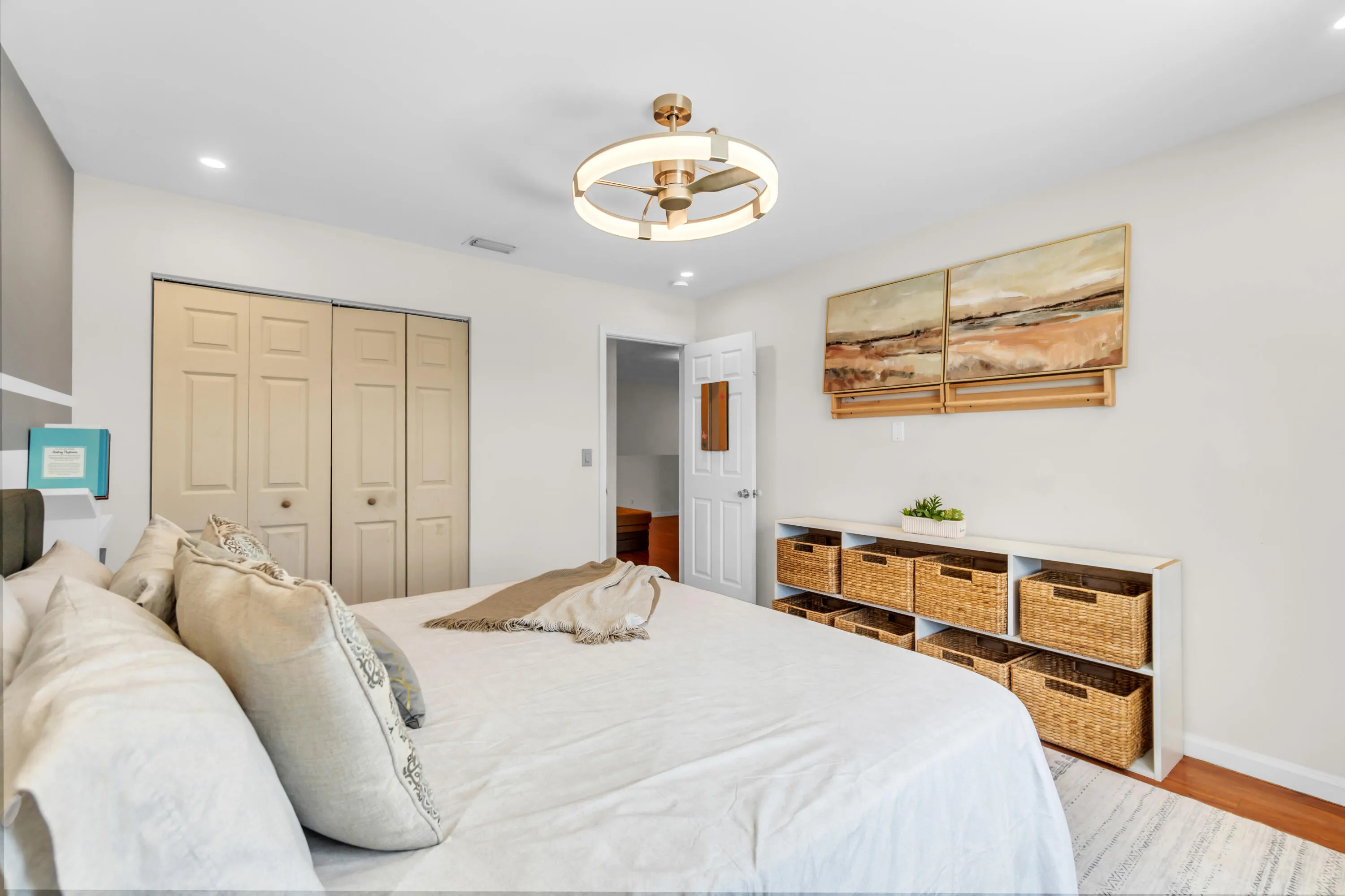 Hardwood-finish flooring, recessed lighting, ceiling fan light fixture, and bifold closet doors