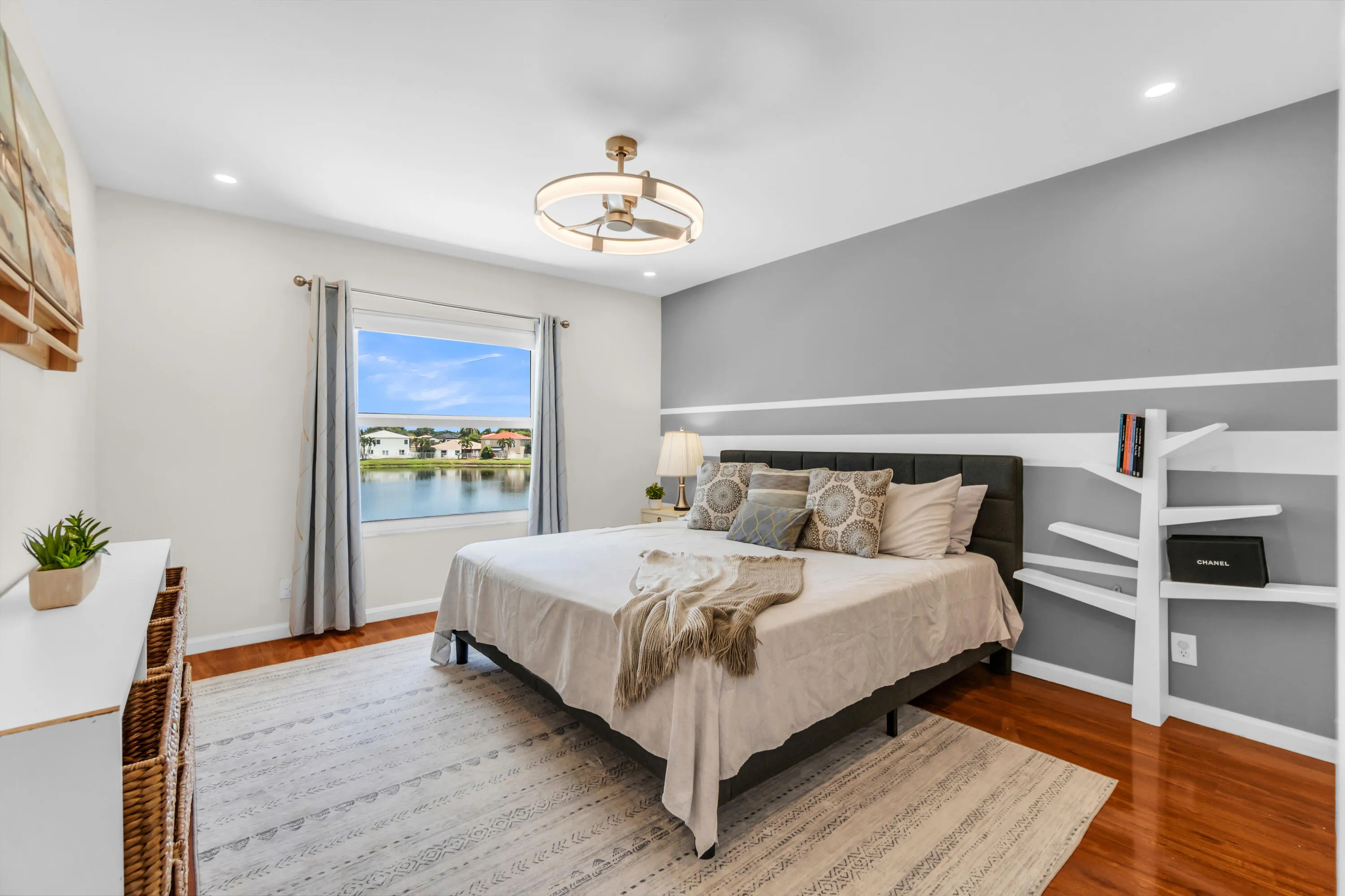 Hardwood-finish flooring, recessed lighting, and a modern ceiling fan with integrated lighting