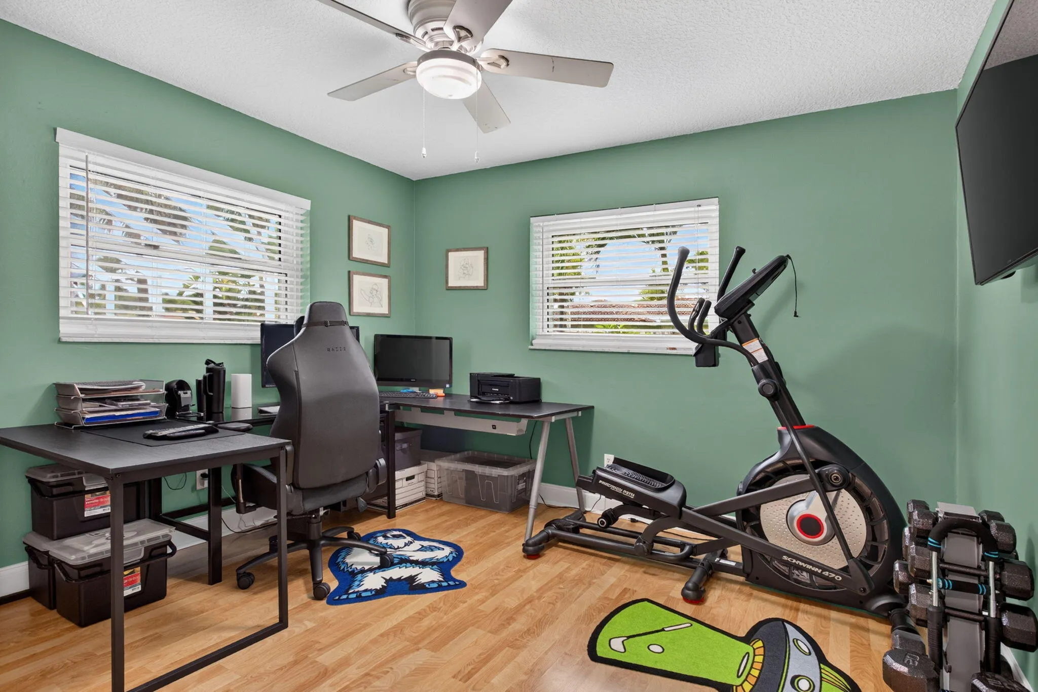 Recessed lighting, wood-finish flooring, and white window blinds