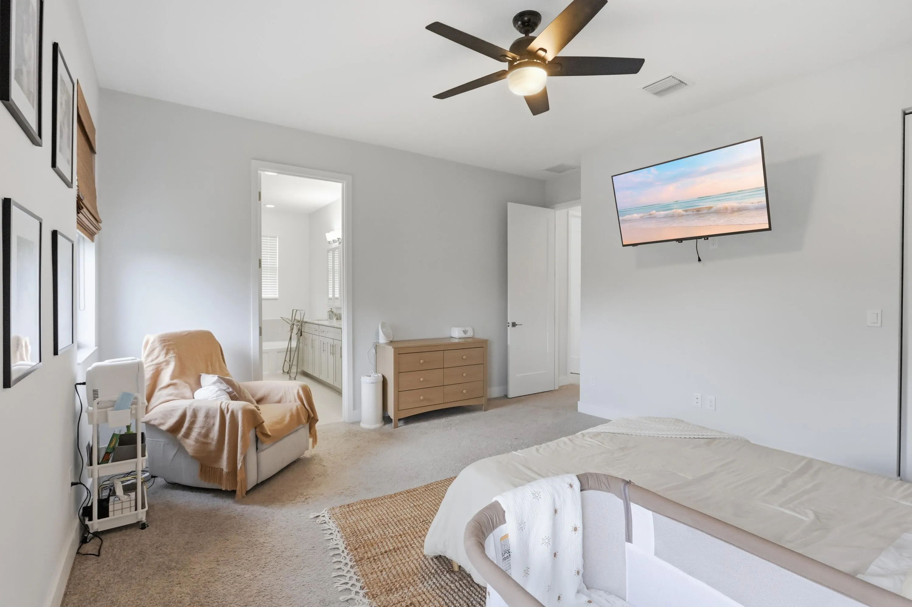 Carpeted bedroom with a ceiling fan, recessed lighting, and a white interior door