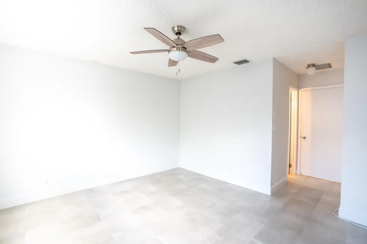 Light gray tile flooring and white walls