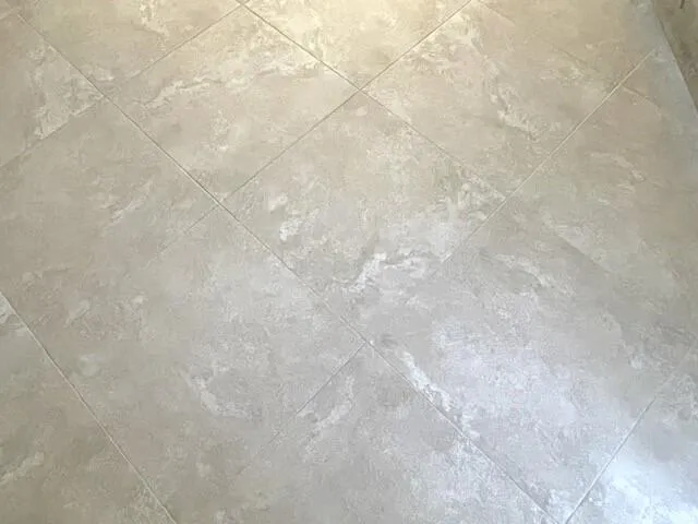 Neutral tile flooring on the diagonal th