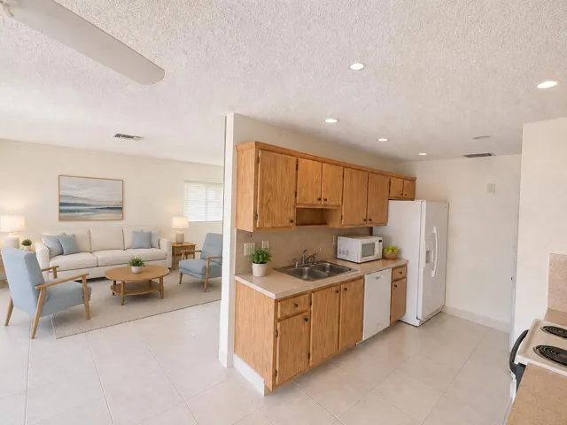 Tile flooring extends into the kitchen area