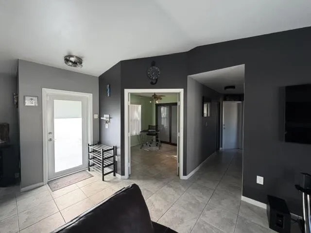 Tiled flooring throughout, with a recessed ceiling light and painted walls