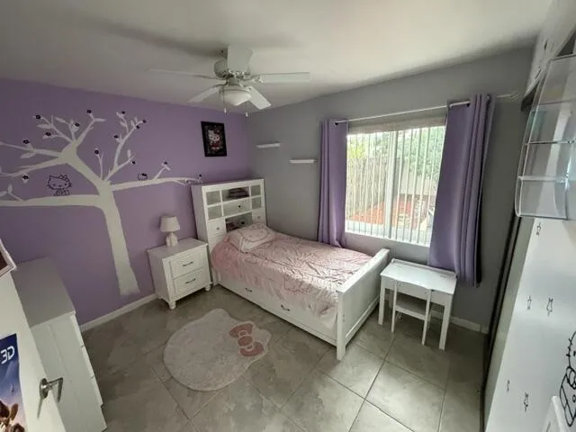 Recessed lighting, tile flooring, and a ceiling fan with integrated lighting