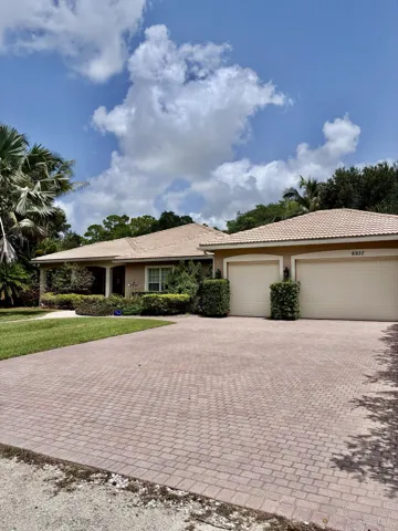 Three car garage with large driveway