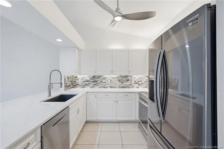 Updated kitchen with quartz countertops and stainless-steel appliances