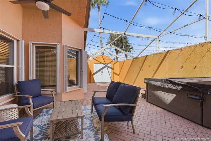 Spacious screened private courtyard with hot tub and outdoor living area