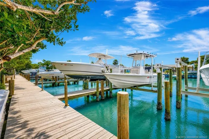 Boat Slip #55 also available for purchase in the community marina with 9,000LB boat lift. A short walk from your villa.