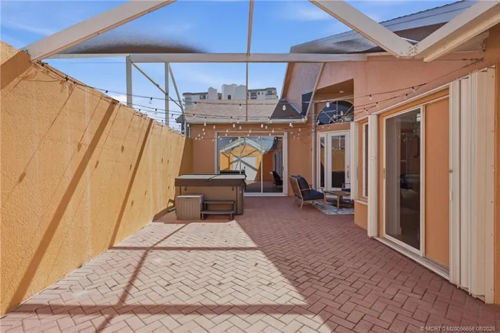 Spacious screened private courtyard with hot tub and outdoor living area