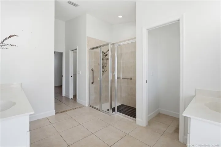 Primary bathroom with walk-in shower and soaking tub.