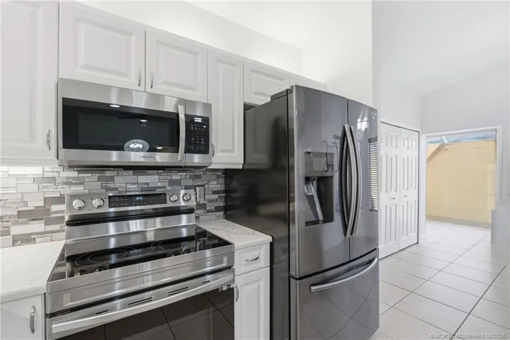 Updated kitchen with quartz countertops and stainless-steel appliances