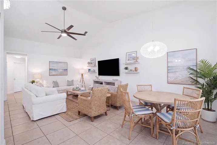 Virtually staged living space. Open floor plan, large living area with high ceilings.