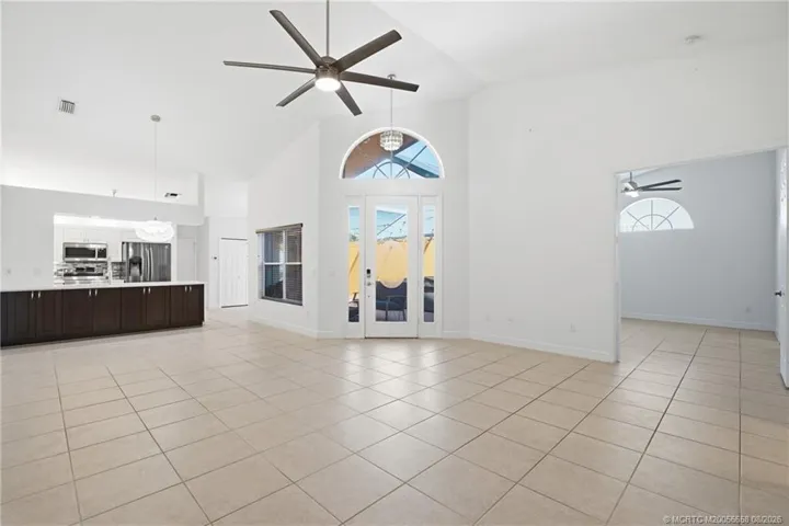Open floor plan, large living area with high ceilings.