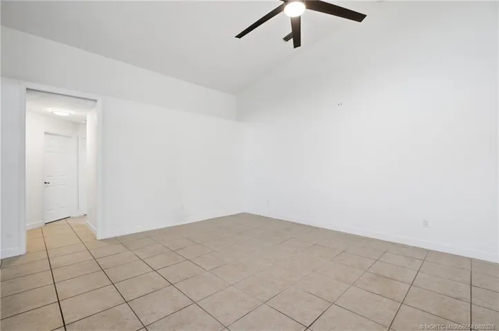 Open floor plan, large living area with high ceilings.